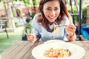 Asian women eating delicious Focus on face